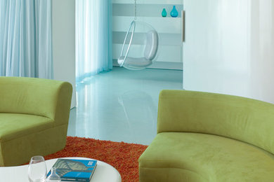 Example of a small minimalist open concept blue floor living room design in Miami with white walls