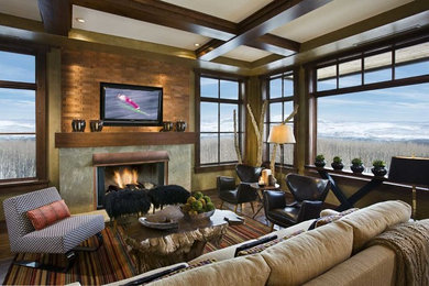 Example of a large mid-century modern open concept dark wood floor living room design in Denver with beige walls, a standard fireplace, a metal fireplace and a wall-mounted tv