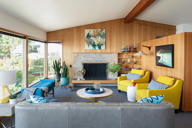 Mid-sized 1950s open concept carpeted and gray floor living room photo in Seattle with white walls, a standard fireplace, a stone fireplace and no tv
