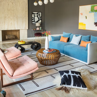 Inspiration for an eclectic light wood floor living room remodel in Los Angeles with gray walls