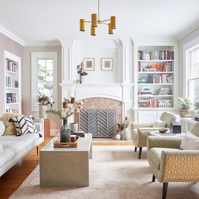 Example of a mid-sized transitional enclosed and formal medium tone wood floor and brown floor living room design in New York with a standard fireplace, a stone fireplace, no tv and beige walls