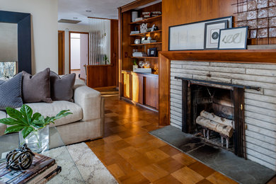 Example of a mid-sized trendy open concept living room design in Providence with a concrete fireplace