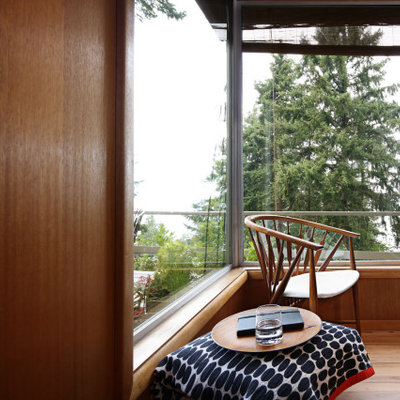 Inspiration for a mid-sized 1950s open concept light wood floor living room remodel in Seattle with white walls, a corner fireplace, a brick fireplace and no tv