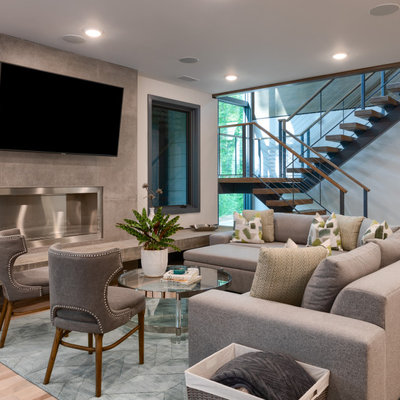 Trendy open concept light wood floor and beige floor living room photo in Other with white walls, a ribbon fireplace, a tile fireplace and a wall-mounted tv