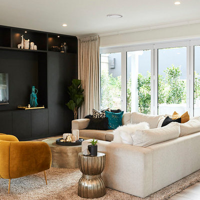 Example of a 1960s formal light wood floor and beige floor living room design in Auckland with gray walls and a wall-mounted tv