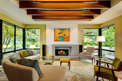 Mid-sized 1960s formal and open concept medium tone wood floor living room photo in San Francisco with white walls, a standard fireplace, a concrete fireplace and no tv