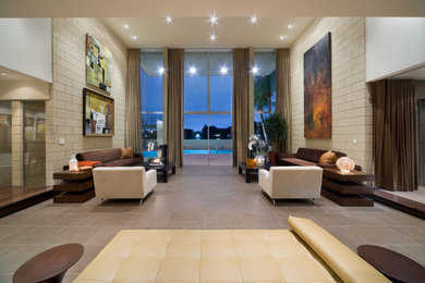 Living room - huge mid-century modern formal and open concept porcelain tile living room idea in Orlando with beige walls