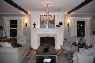 Example of a large transitional dark wood floor living room design in Other with blue walls, a standard fireplace and a stone fireplace