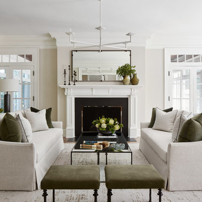 Inspiration for a mid-sized transitional enclosed and formal medium tone wood floor and brown floor living room remodel in Chicago with gray walls, a standard fireplace and no tv