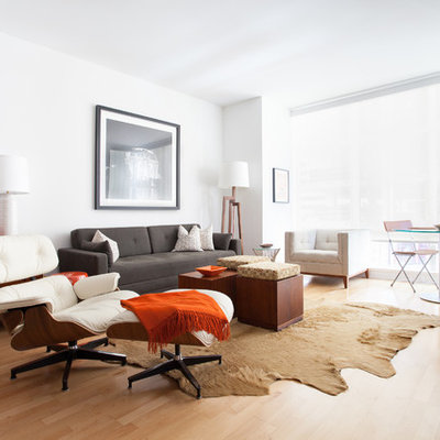 Living room - contemporary formal light wood floor living room idea in San Francisco with white walls and a wall-mounted tv