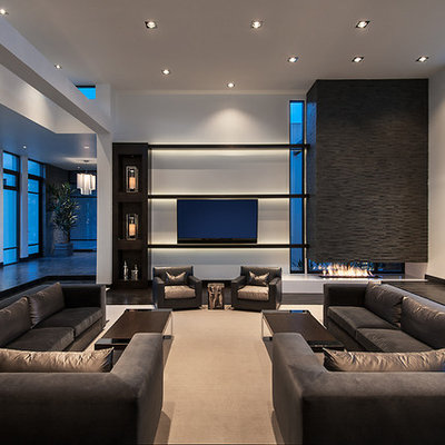 Trendy formal and open concept dark wood floor living room photo in Phoenix with white walls, a two-sided fireplace and a wall-mounted tv