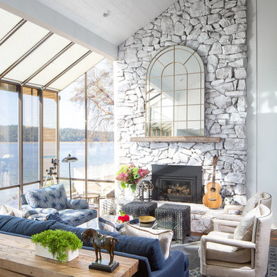 Example of a mid-sized beach style formal and open concept dark wood floor and brown floor living room design in Seattle with white walls, a standard fireplace, a stone fireplace and no tv