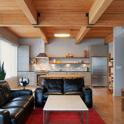 Living room - contemporary open concept living room idea in Portland with gray walls and a wall-mounted tv