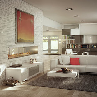 Inspiration for a large contemporary light wood floor living room remodel in Miami with a two-sided fireplace and a stone fireplace