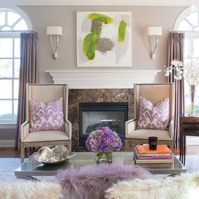 Inspiration for a timeless medium tone wood floor living room remodel in New York with gray walls, a standard fireplace and no tv