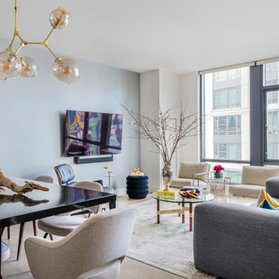 Inspiration for a small contemporary open concept light wood floor and beige floor living room remodel in Boston with gray walls and a wall-mounted tv