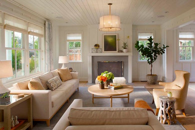Living room - country formal light wood floor living room idea in San Francisco with white walls, a standard fireplace and no tv
