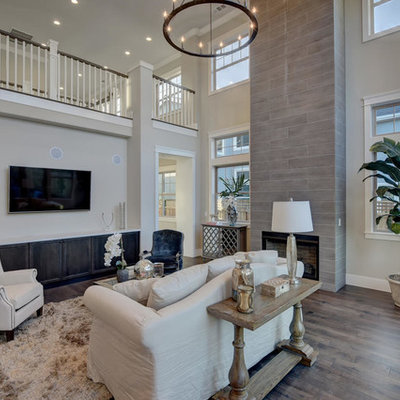 Large transitional formal and enclosed dark wood floor and brown floor living room photo in San Francisco with beige walls, a standard fireplace, a tile fireplace and a wall-mounted tv