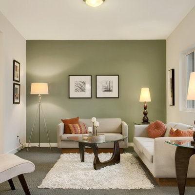 Inspiration for a transitional enclosed living room remodel in Seattle with green walls
