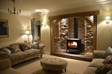 Inspiration for a rustic living room in Buckinghamshire with a wood burning stove.