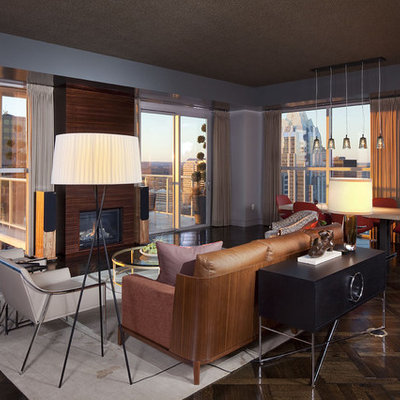 Example of a minimalist living room design in Austin with blue walls and a standard fireplace