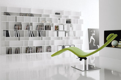 Example of a minimalist open concept porcelain tile living room library design in Miami with white walls, no fireplace and no tv