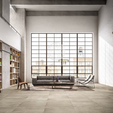 Modern living room library with large cement look porcelain tile