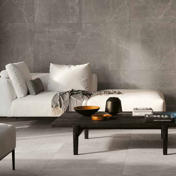 Modern living room with grey stone look porcelain tile