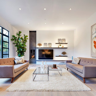 Inspiration for a contemporary formal light wood floor living room remodel in San Francisco with white walls, a ribbon fireplace and a wall-mounted tv