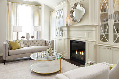 Inspiration for a large transitional formal and enclosed dark wood floor and brown floor living room remodel in Toronto with white walls, a standard fireplace, a wood fireplace surround and no tv