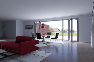 Diseño de salón abierto minimalista grande con paredes grises, suelo de madera clara y suelo marrón