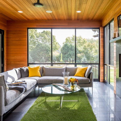 Inspiration for a huge contemporary open concept porcelain tile and gray floor living room remodel in Minneapolis with a standard fireplace, a tile fireplace, brown walls and no tv