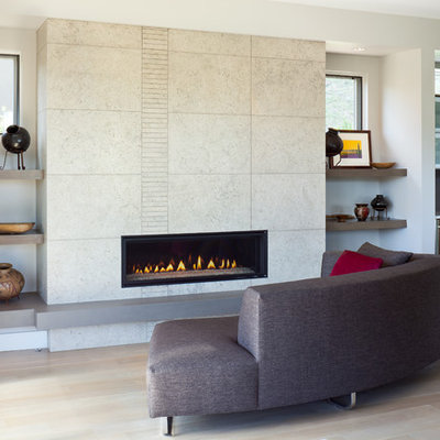 Example of a mid-sized trendy open concept light wood floor and beige floor living room design in Denver with a ribbon fireplace, white walls and a tile fireplace