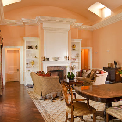 Inspiration for a timeless formal and open concept medium tone wood floor living room remodel in San Francisco with pink walls, a standard fireplace and no tv