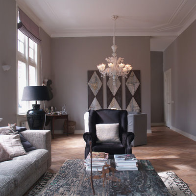 Example of a trendy living room design in Amsterdam with gray walls