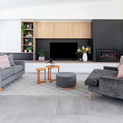 Large trendy open concept and formal ceramic tile and gray floor living room photo in Geelong with white walls, a wood fireplace surround, a wall-mounted tv and a standard fireplace
