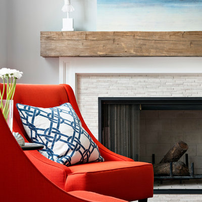 Inspiration for a mid-sized coastal open concept medium tone wood floor living room library remodel in San Francisco with a standard fireplace, a wall-mounted tv, a stone fireplace and blue walls