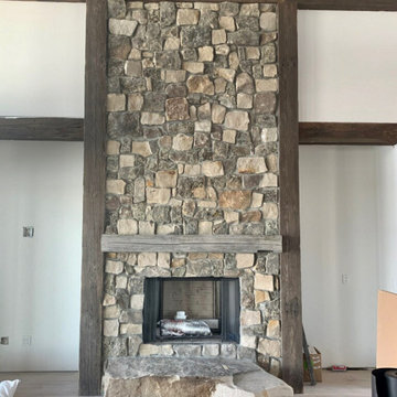 Moss Rock Real Thin Stone Veneer Floor to Ceiling Fireplace