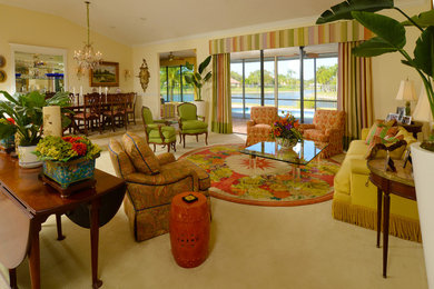 Living room - large eclectic open concept carpeted living room idea in New York with yellow walls