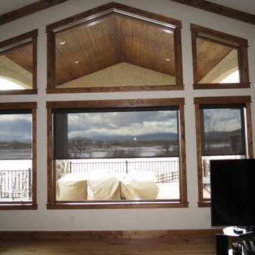 Motorized screen shades control the glare/preserve the view