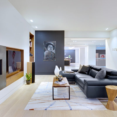 Living room - scandinavian open concept and formal light wood floor living room idea in Toronto with white walls, a ribbon fireplace, a metal fireplace and a media wall