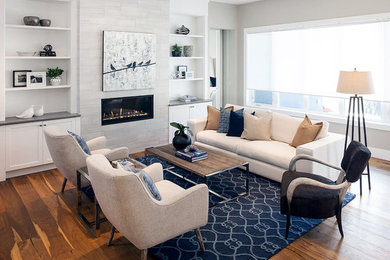 Living room - mid-sized transitional open concept light wood floor living room idea in Calgary with white walls, a ribbon fireplace and a metal fireplace