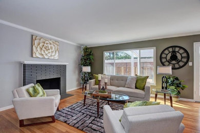 Mid-sized 1960s formal and open concept light wood floor and beige floor living room photo in San Francisco with gray walls, a standard fireplace, a tile fireplace and no tv