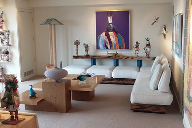 This is an example of a medium sized modern open plan living room in Other with white walls and carpet.