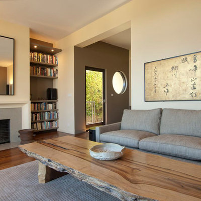 Enclosed brown floor living room photo in San Francisco with beige walls, a standard fireplace and no tv