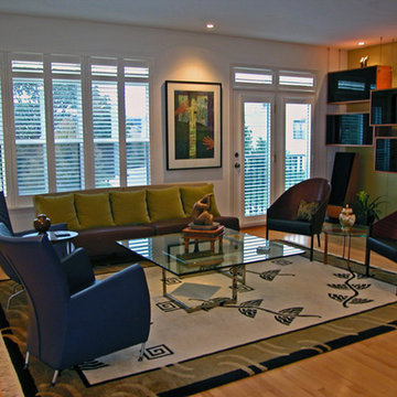 Multi-functional living room featuring a cable supported media center.
