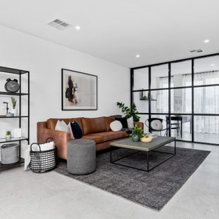 Inspiration for a mid-sized scandinavian open concept living room in Perth with white walls and grey floor.