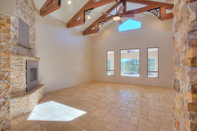 Foto de salón abierto de estilo de casa de campo grande con paredes beige, suelo de travertino, chimenea de esquina y marco de chimenea de piedra