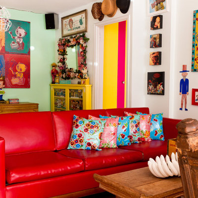 Eclectic enclosed living room photo in New York with green walls