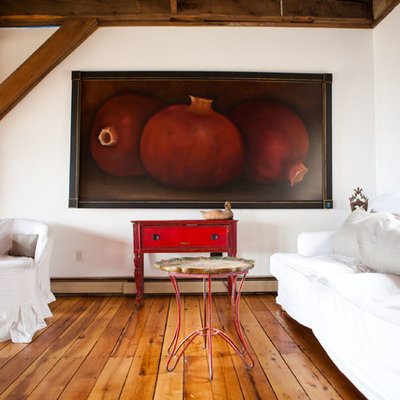 Inspiration for a cottage medium tone wood floor living room remodel in Burlington with white walls